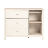 Wanderer Changing Table with Drawers in cashmere finish, oak-effect top, three drawers with brushed metal handles, open side shelving with hanging rail, on a plain white background.