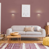 Ceramic wall light, shown in a room setting