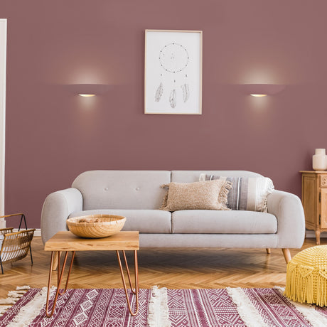 Ceramic wall light, shown in a room setting