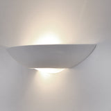 Ceramic wall light, shown on a dark background