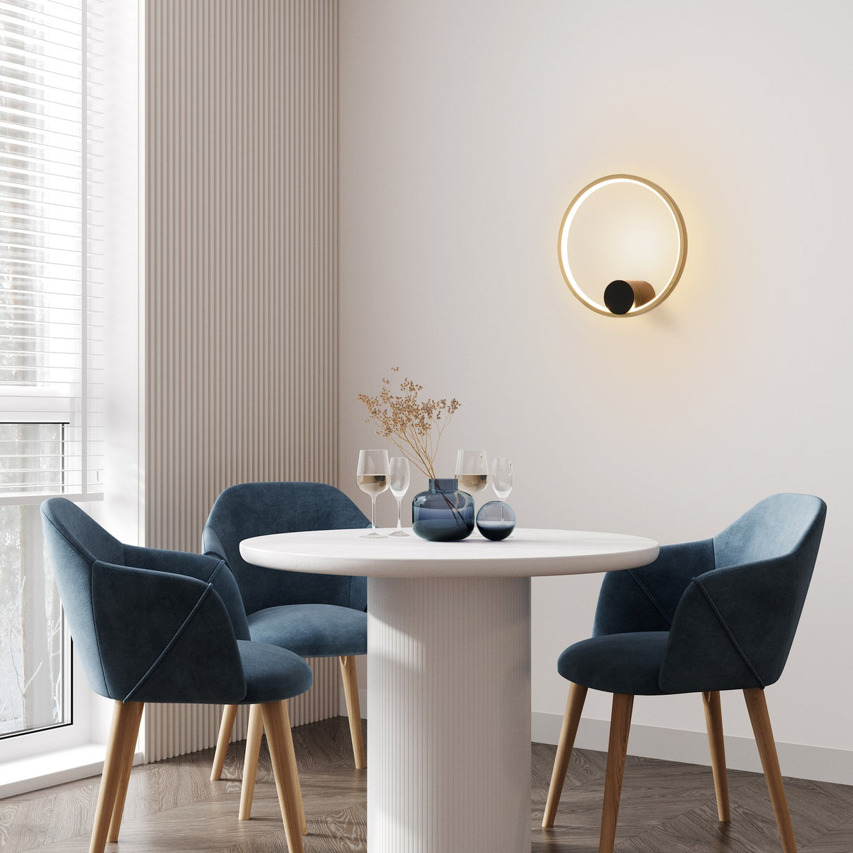Eclipse wall light in black and gold finish, shown in a room setting