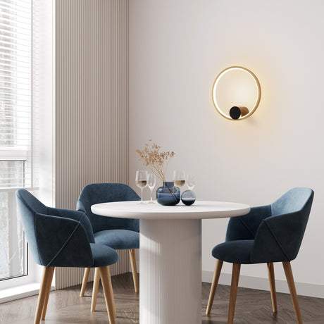 Eclipse wall light in black and gold finish, shown in a room setting