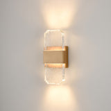Frost exterior wall light in brass finish, shown on a dark background