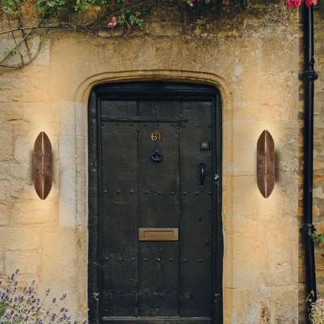 Warrior 2 light exterior wall light in copper finish, shown in a garden setting
