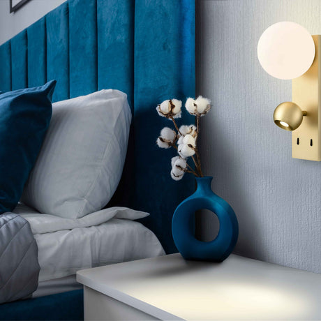 Iris 2 light wall light in satin brass finish, shown in a room setting