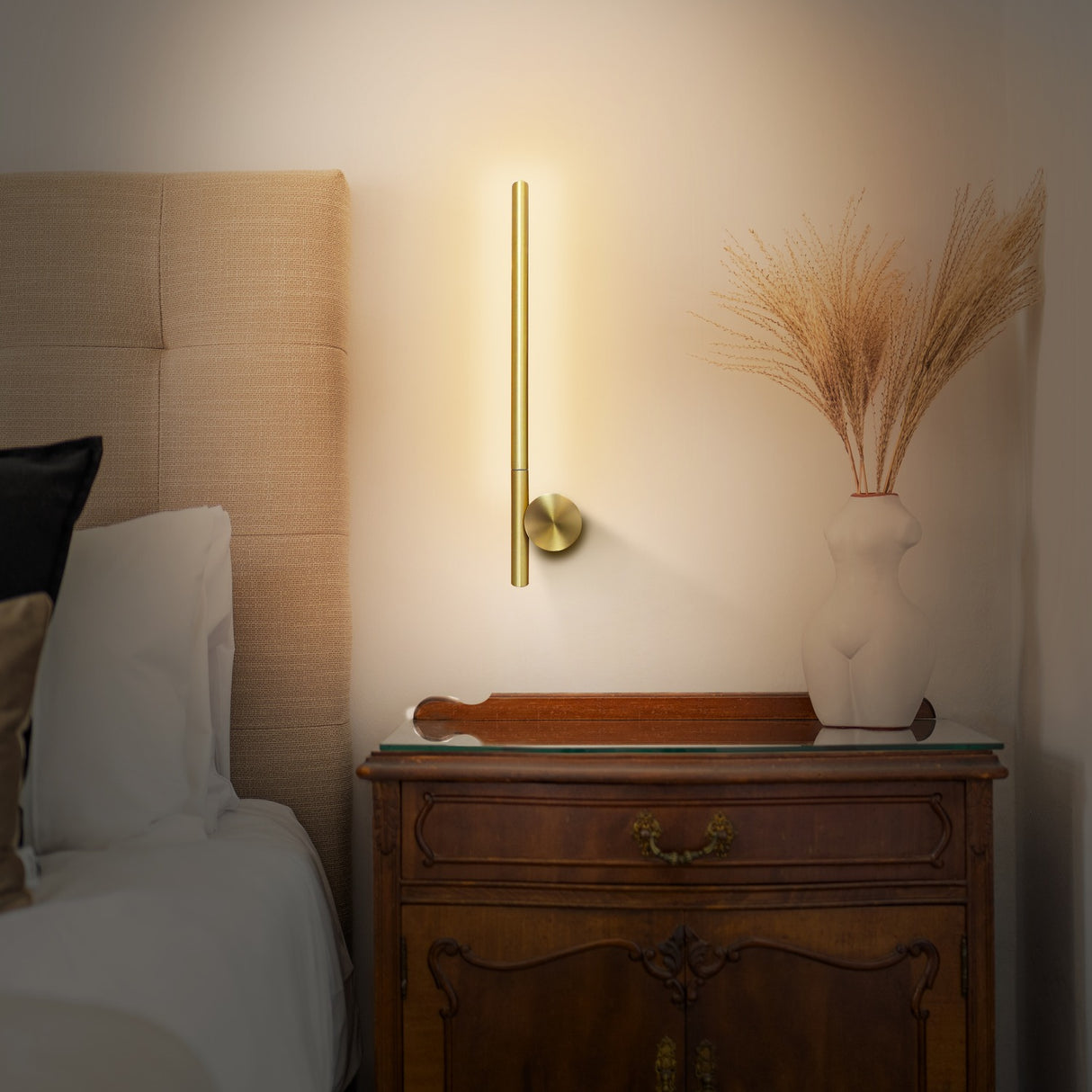 Fabula wall light in satin brass finish, shown in a room setting