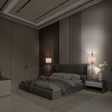 Serenity 2 light wall light in black and gold finish, shown in a room setting