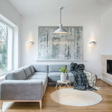 Infinity wall light, shown in a room setting