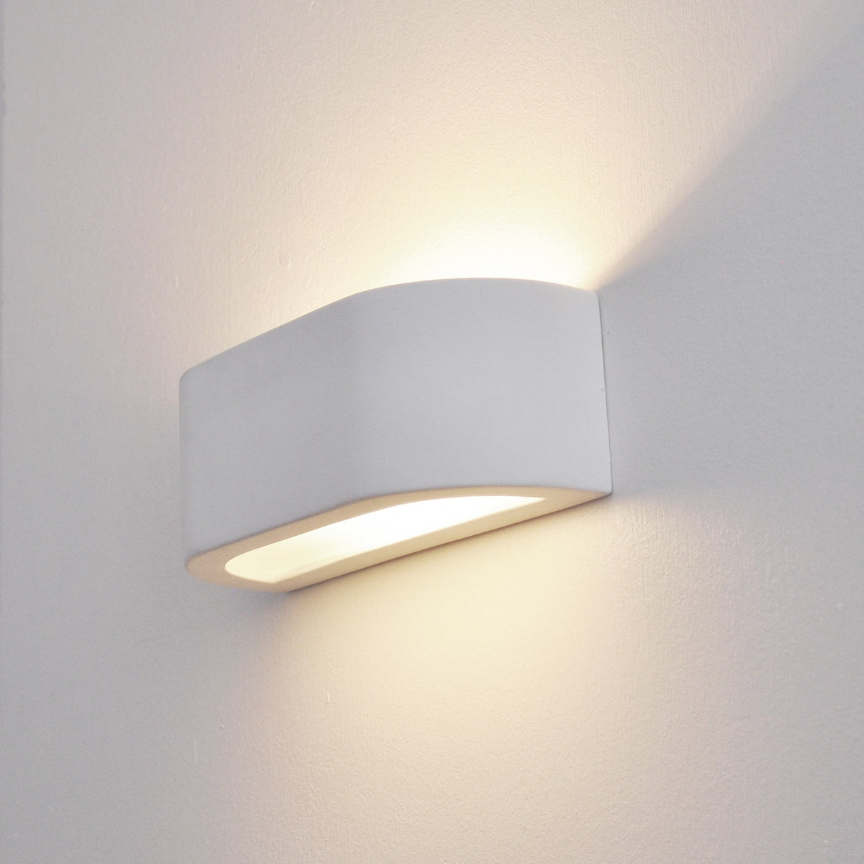 Fresco wall light, shown on a dark background