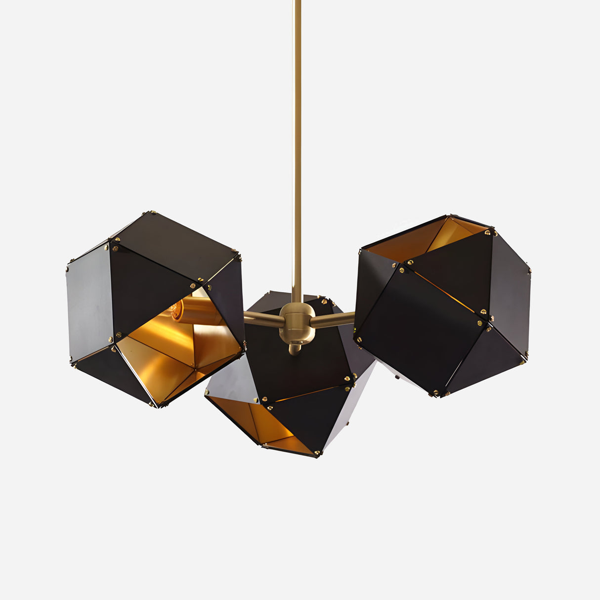 The Spar 3 Light Pendant - Black & Gold features three geometric polyhedral lampshades, each suspended from a single gold rod. Its angular design infuses contemporary elegance, transforming the fixture into an artistic focal point against a plain background.