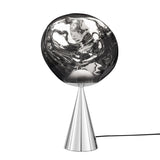 The Lava LED Table Lamp - Silver features a shiny, cone-shaped metallic base, a large reflective glass shade with abstract wavy texture, and a black power cord—perfect for adding modern style to contemporary interiors.