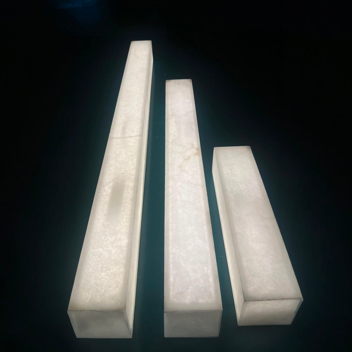Valmera LED slim vertical alabaster wall light in soft white, shown in three lengths with rectangular stone columns, on a plain dark background.