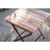 Yatin Outdoor Side Table - Natural in a garden, view 2