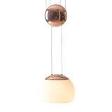 The Yoyo LED Pendant Light - Copper showcases a modern copper finish, large frosted white glass shade, and energy-efficient LED lighting, suspended by two thin wires for a sleek, contemporary look.