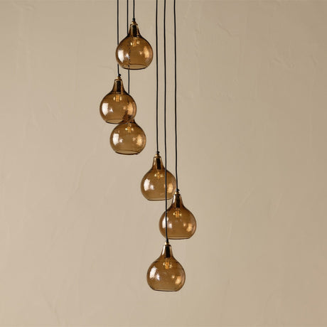 Ziva 6 Light Cluster Pendant Light in light smoke brown glass, six teardrop shades with brass collars on black flex at staggered lengths, set against a plain neutral background.