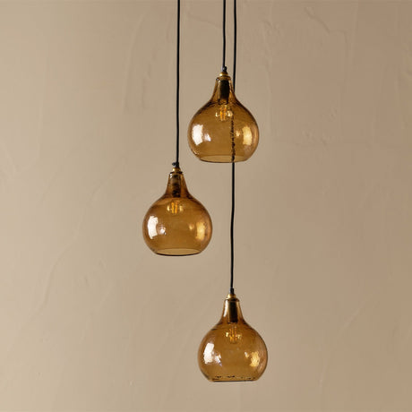 Ziva 3 Light Cluster Pendant Light in light smoke brown, three hammered glass teardrop shades with brass collars on black flex at staggered lengths, shown against a plain background.