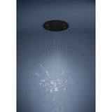 Adrados 6-light pendant with round black steel canopy and clear glass butterfly pieces suspended on fine wires, shown against a soft blue background.