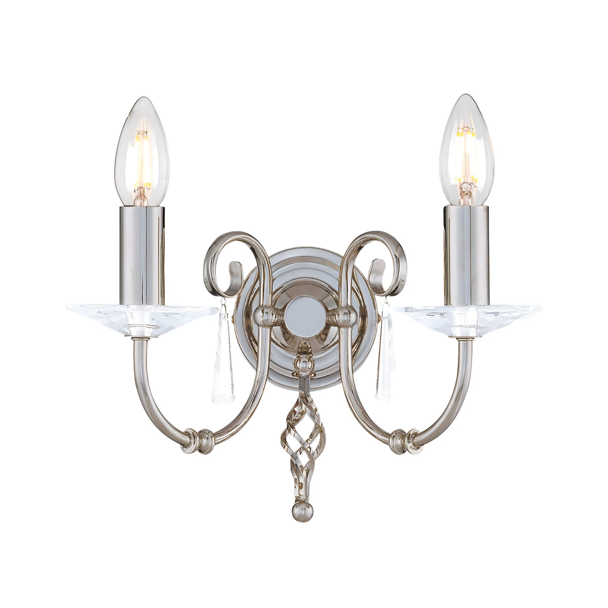 The Aegean 2 Light Wall Light in a polished nickel finish features a decorative design with two upward-facing candle-style bulbs on hand-forged scrolls, embellished with cut-glass droplets and attached to a round base.