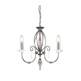 The Aegean 3 Light Chandelier - Polished Nickel features a polished nickel finish with an ornate, spherical cage design and two curved arms holding candle-like fixtures. Crystal accents dangle beneath each of its three lights, making it an ideal modern light fixture for any sophisticated space.