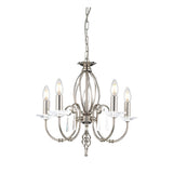 The Aegean 5 Light Chandelier in Polished Nickel features a chain-suspended design with a frame of hand-forged scrolls, curved arms, and candle-style bulbs. Decorative crystal accents complete the look, adding an elegant touch.