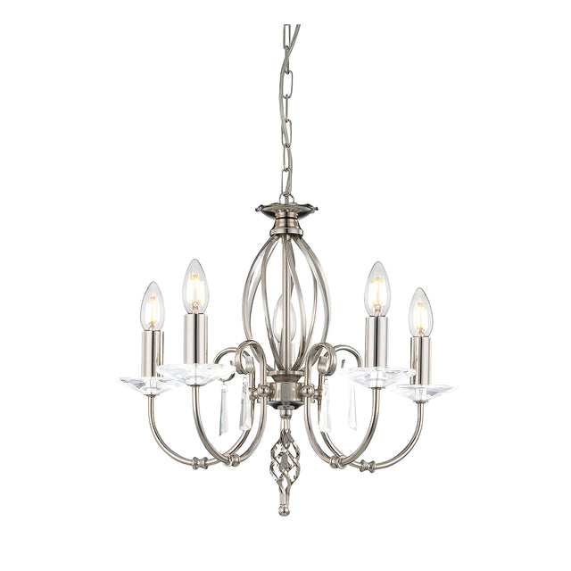 The Aegean 5 Light Chandelier in Polished Nickel features a chain-suspended design with a frame of hand-forged scrolls, curved arms, and candle-style bulbs. Decorative crystal accents complete the look, adding an elegant touch.