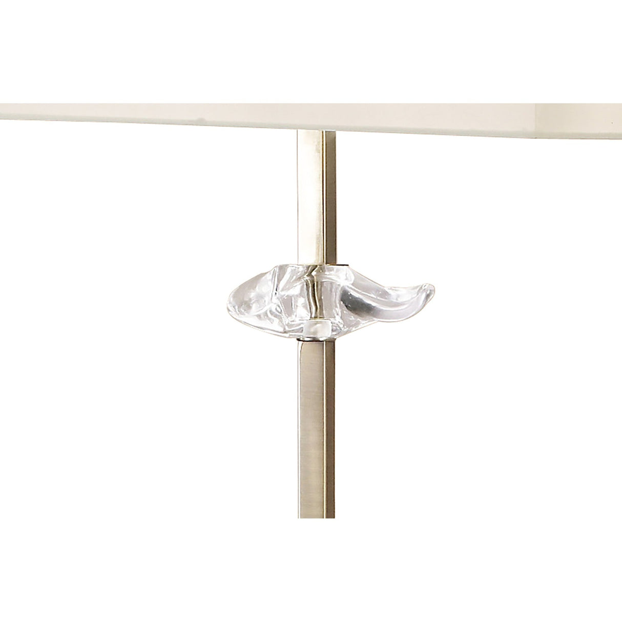 Close-up of the Akira 3 Light Floor Lamp in antique brass, featuring a metal rod with a clear, sculpted glass accent just below the surface, elegantly supporting its cream shade.
