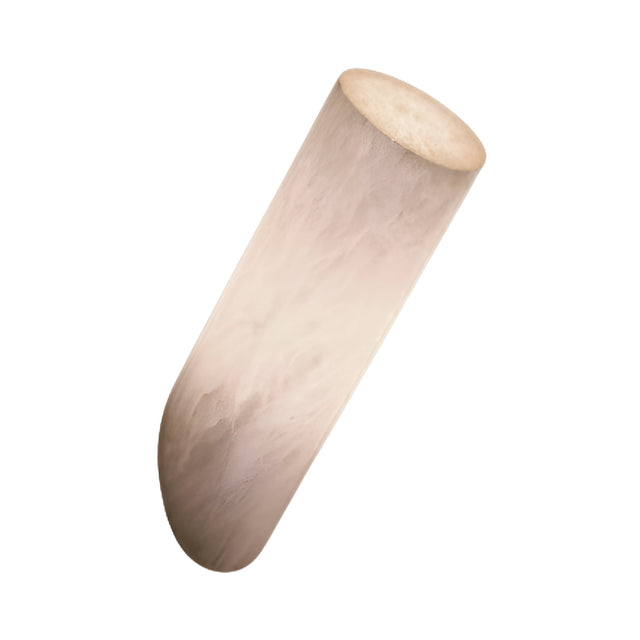 A single, cylindrical white root vegetable with a smooth surface, reminiscent of the Caelith LED Angled Cylinder Alabaster Wall Light – Soft White, isolated on a white background.