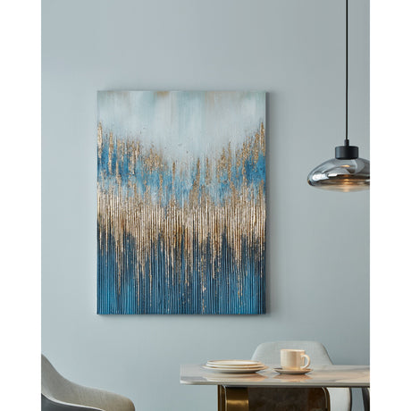 Alaminos Wall Art 90 x 120cm, a portrait abstract canvas with pale blue-grey top fading to navy base and vertical metallic gold streaks, shown hanging in a dining room beside a pendant light.