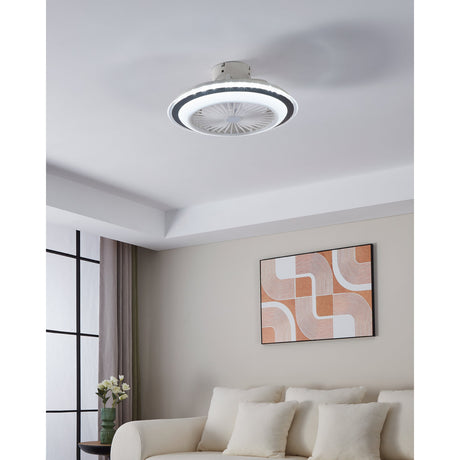 Albufeira Ceiling Fan with Light in white and grey, round low-profile design with illuminated ring and white blade grille, shown installed in a living room with artwork and sofa below.