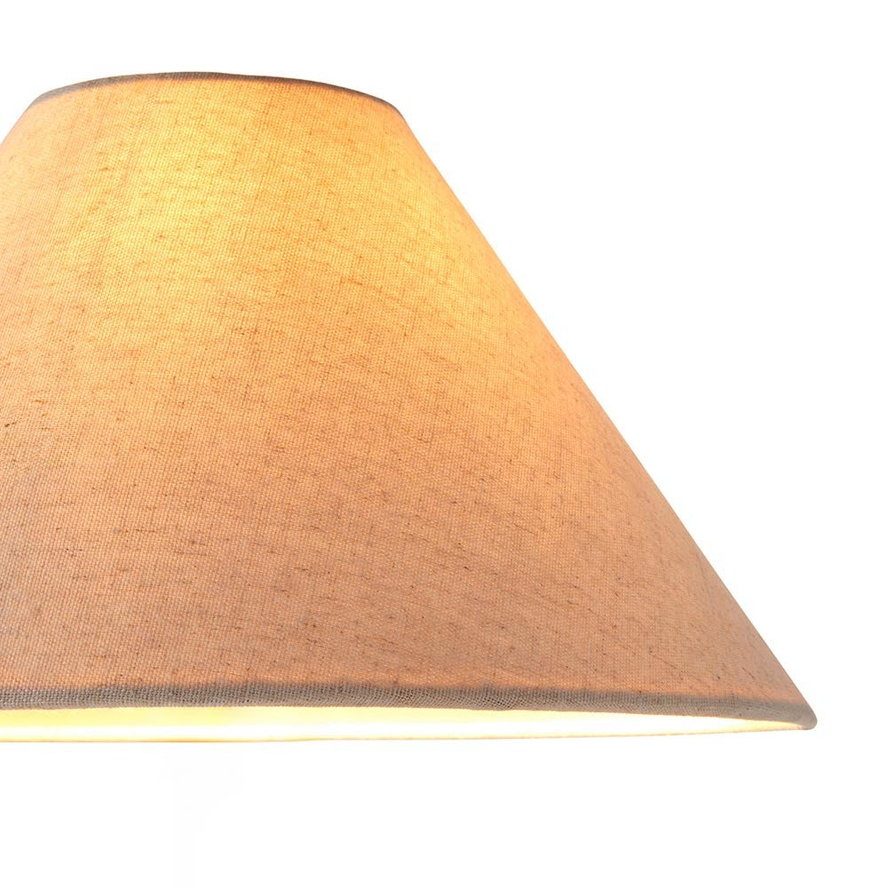 Endon Aldmere 31cm tapered lamp shade in natural faux linen, shown close-up with a warm illuminated interior against a plain white background.
