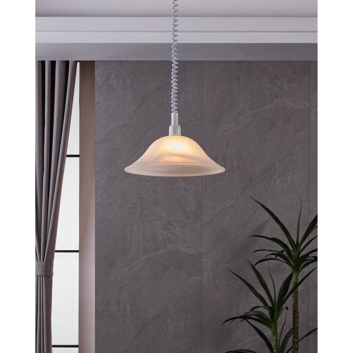 Alessandra Glass Pendant Light in White, a rise-and-fall pendant with a wide bell-shaped alabaster glass shade and marbled swirls, on a coiled cord.