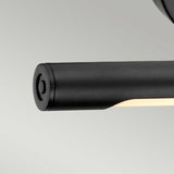 Featuring a close-up of the Alton 1 Light Small LED Picture Light in black, this modern cylindrical wall fixture stands out against a light gray background. Its sleek design and recessed light source make it ideal for illuminating artwork in compact spaces.