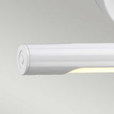 The Alton 1 Light Small LED Picture Light in white, mounted on a light gray wall, features a clean and modern design. This energy-efficient fixture emits a soft glow from below, enriching spaces with its subtle illumination.