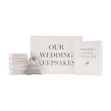 Grey rectangular wedding keepsake box set with four labelled slide-out boxes, a drawstring pouch, and a Memories of Our Special Day hardcover book on a white background.