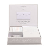 Grey wedding keepsake box, white-lined, with a Memories of Our Special Day book, labelled slide-out boxes, envelope, pouch, and The best is yet to come script on the front edge.