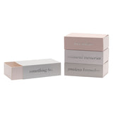 Rectangular grey keepsake box set with sliding drawer-style lids reading "something blue," "love tokens," "treasured memories," and "precious keepsakes" against a plain white background.