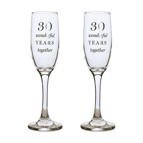 Set of 2 clear glass champagne flutes with tall, narrow bowls, each printed in silver text "30 wonderful YEARS together" on a plain white background.