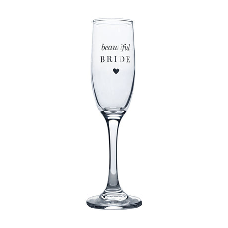 Clear glass champagne flute with tall slender bowl and long stem, printed "beautiful BRIDE" in silver script and capitals above a small heart, shown on a plain white background.