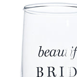 Close-up of a clear glass champagne flute showing "beautiful BRIDE" printed in silver script and capital lettering, set against a plain white background.
