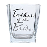 Clear square glass whisky tumbler with thick base, "Father of the Bride" in flowing silver and black script, shown on a plain white background.