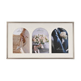 Triple metal photo frame in silver with a cream mount featuring three arch-topped windows for 6 x 4in photos, shown on a plain white background.