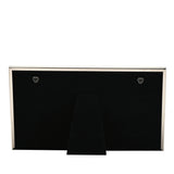 Back view of the Triple Metal Photo Frame 6x4in in silver, showing black velvet backing, two hanging hooks, and a fold-out stand, on a plain white background.