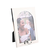 Silver metal photo frame with an arched rectangular border and linked rings adorned with small stones at the base, holding a 6 x 4in wedding portrait, shown at an angle on a white background.