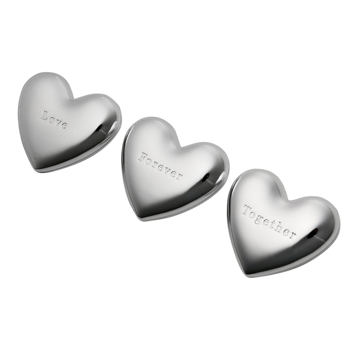 Three silverplated heart-shaped ornaments with a mirror-bright finish, each engraved with "Love", "Forever" and "Together" in typewriter lettering, arranged on a white background.
