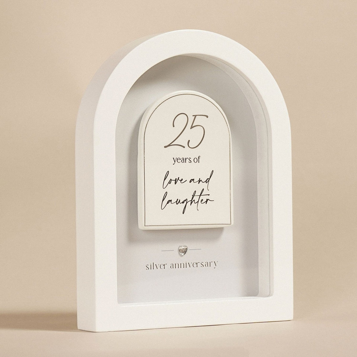 White arched MDF plaque, 18cm, with a raised arch panel reading "25 years of love and laughter" and "silver anniversary" beneath a small heart detail, on a plain background.