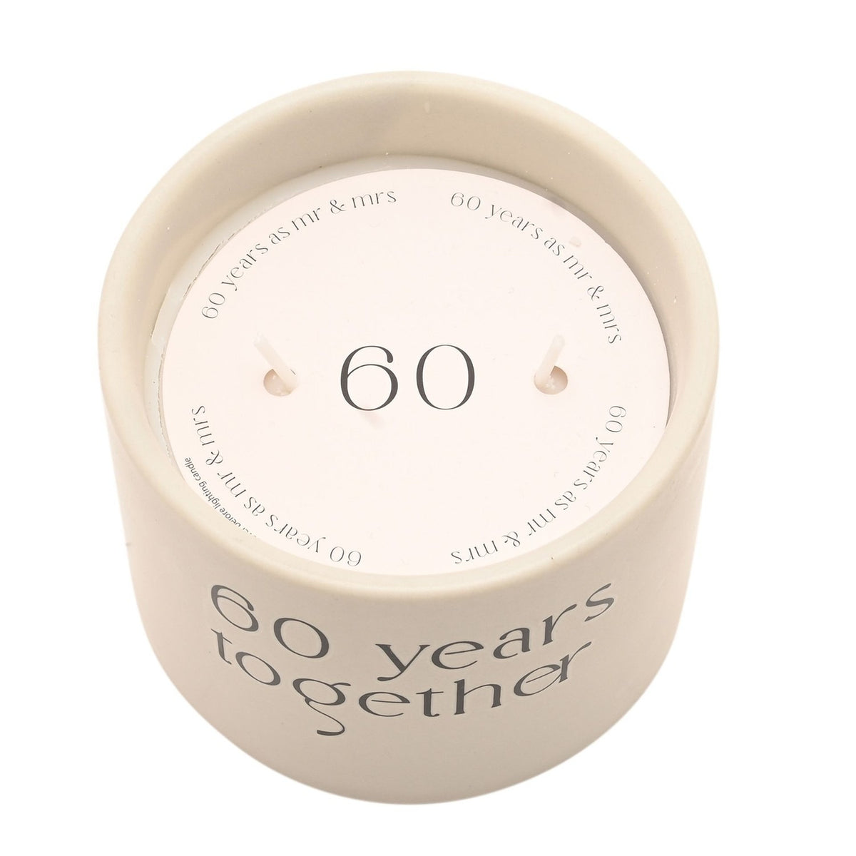 Top-down view of the white 60 Years Together ceramic candle with double wicks, a round 60 insert, and side text reading 60 years together.