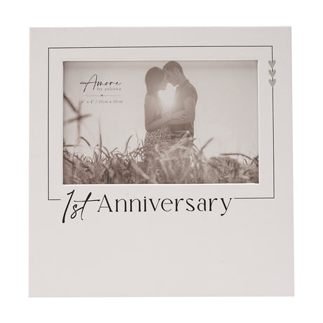 White wooden 1st Anniversary photo frame for a 6 x 4in landscape photo, black script text, fine black border and three stacked silver hearts in one corner.
