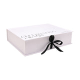 White rectangular A4 keepsake box with hinged lid printed "Celebrating a beautiful bride to be" in black script, tied with a black ribbon bow, on a plain white background.