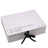 White rectangular A4 keepsake box with "Celebrating a beautiful bride to be" printed in black on the lid, closed with a black ribbon tie, on a plain background.
