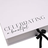 White rectangular A4 keepsake box with hinged lid printed "Celebrating a beautiful bride to be" in black script, closed with a black ribbon tie.